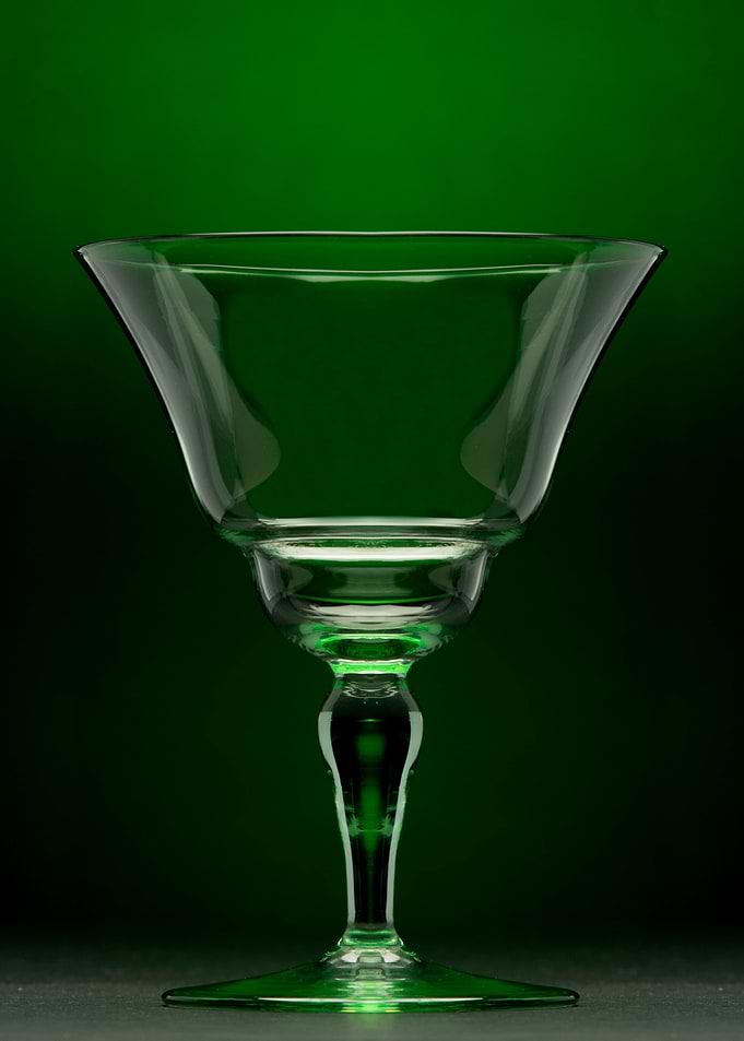A beautiful wine glass surrounded by a green haze.