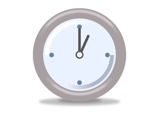 Clock One Silver and blue clock on white background sho ...