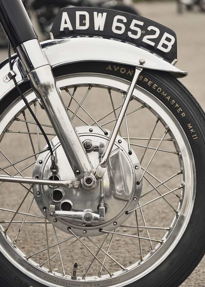 Close up of a front wheel and drum brake of a classic B ...