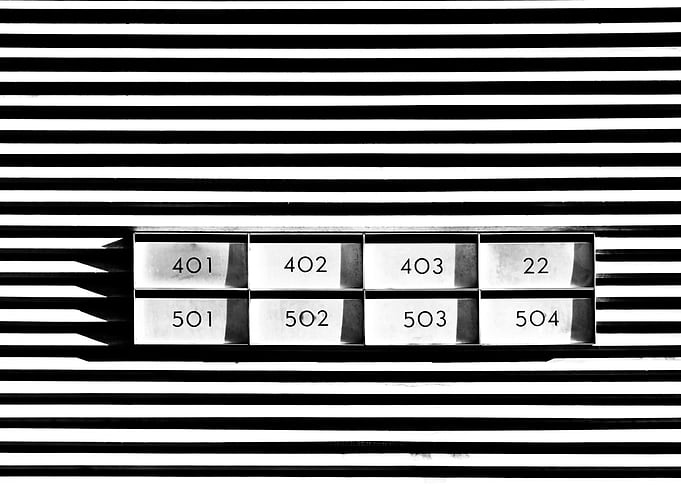 Industrial letterboxes on an abstract monochrome backgr ...