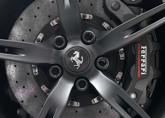 Close up of a wheel and disc brake caliper of modern Fe ...