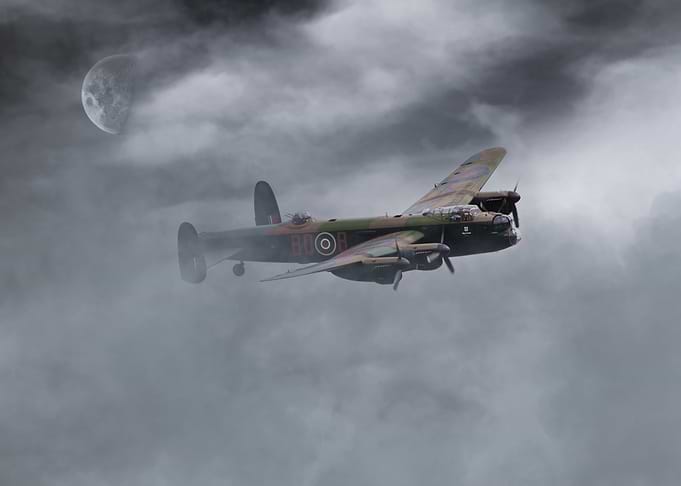 RAF Bomber Command Lancaster Bomber climbs through the ...
