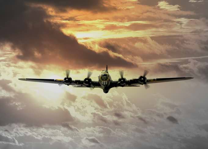 B17 Flying fortress set against a golden yellow sunset