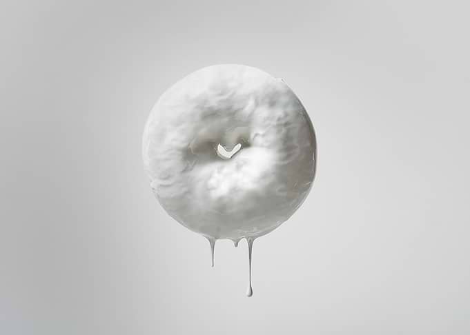 Glossy donut on white.