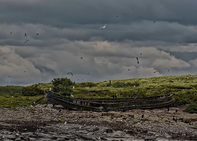 Little boat marooned on an island near to Farne Island ...