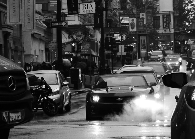 Chevrolet Camaro lighting up a steaming manhole on a Sa ...