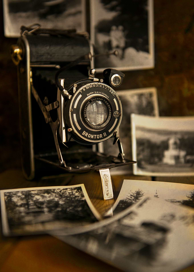 Old style camera and some black and white photos