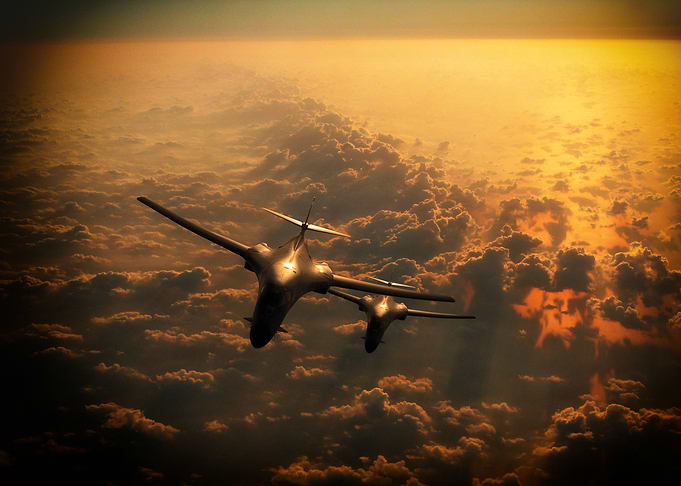 B1 Lancesr 'Bone' stacked abouver the clouds as the sun ...