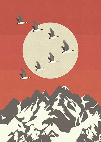 Migratory birds flying over the mountains.