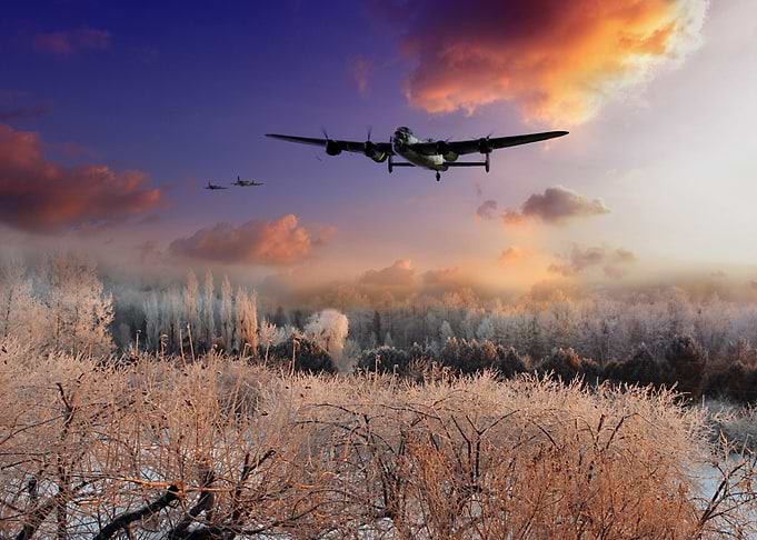 A Royal Air Force Avro Lancaster bomber flanked by two ...
