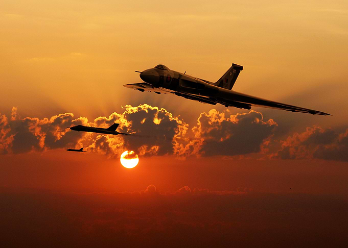 RAF Vulcan Bombers silhouetted against the sun