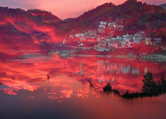 Wonderful pink sunset over beautiful seaside village an ...
