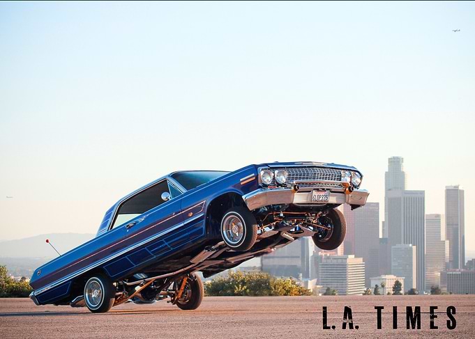 A custom 1963 Chevy Impala lowrider car is seen hopping ...