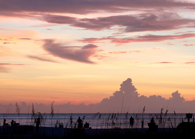 A silhouette sunset beach scene taken on the west cost ...