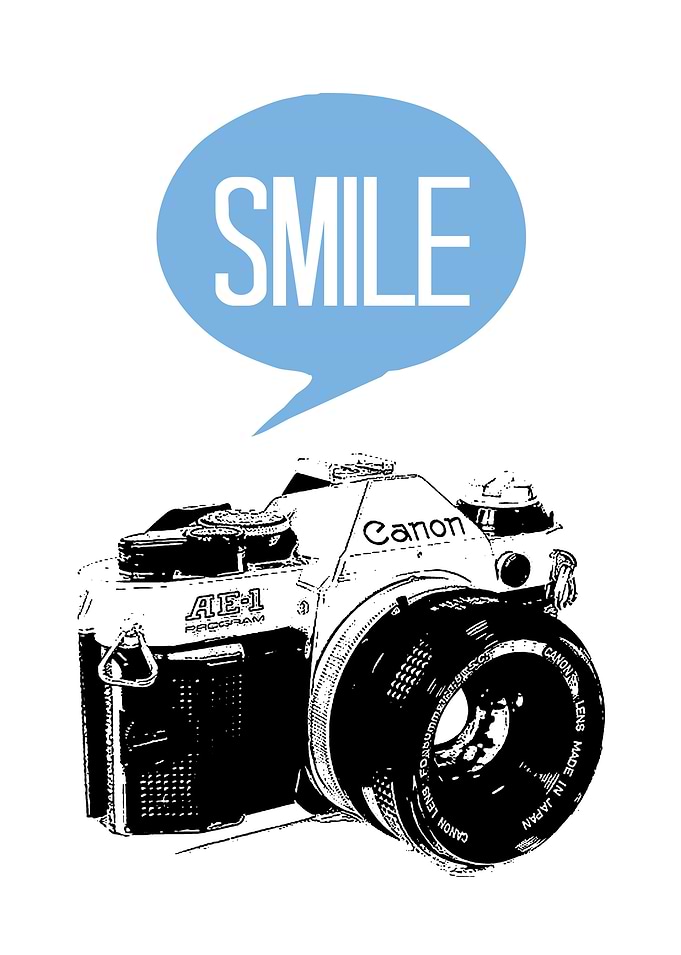 A vintage canon camera with a text balloon with smile i ...