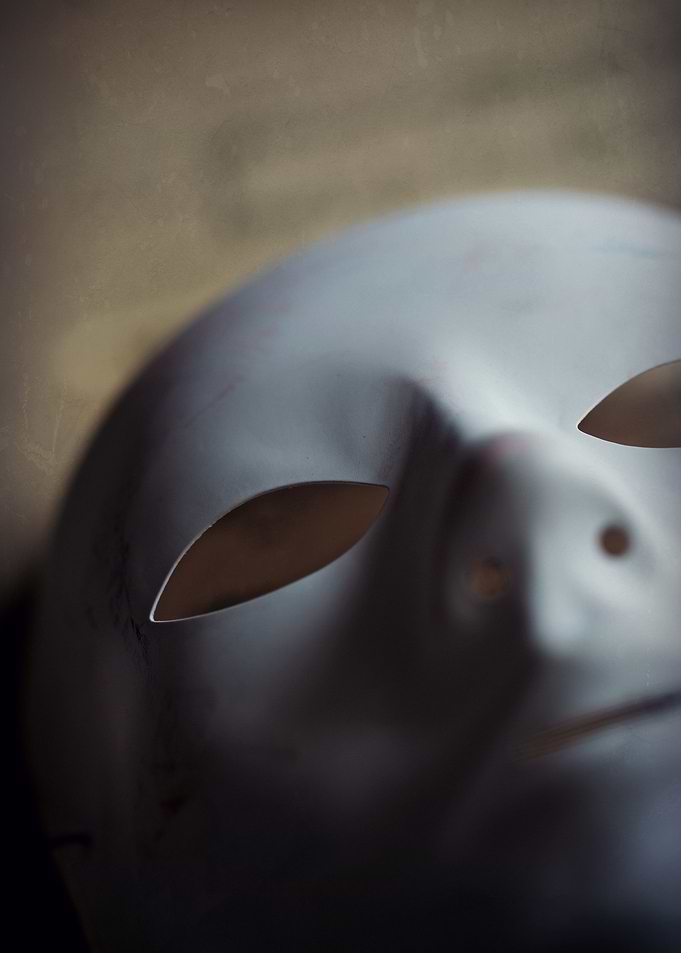 White mask on the table. Close up