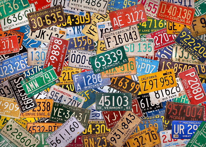 Colorful Assorted Vintage USA License Plates.
