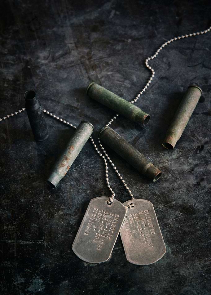 Old rusty bullets and silver dogtags