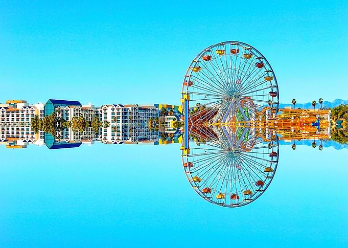 ferris wheel in the city with blue sky