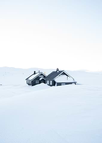 Snow covered cabin in the Norwegian mountains.