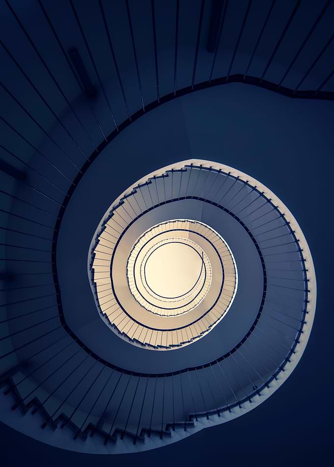 Spiral staircase in blue and creamy tones