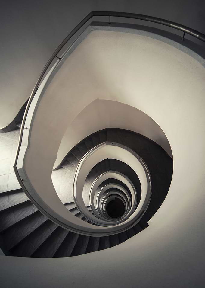 Spiral staircase in beige tones