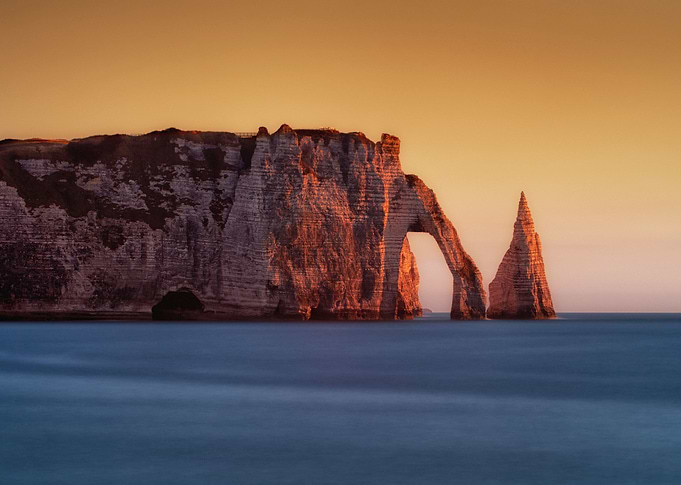 The Porte d'Aval and L'Aiguille at Etretat, a commune i ...