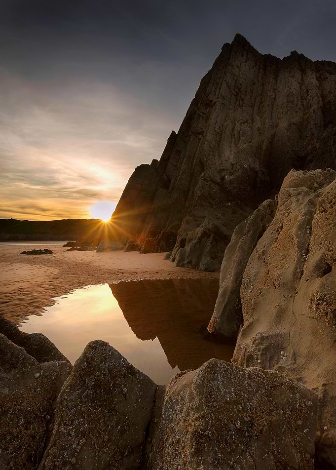 Sunset at Three Cliffs Bay on the Gower peninsula,
