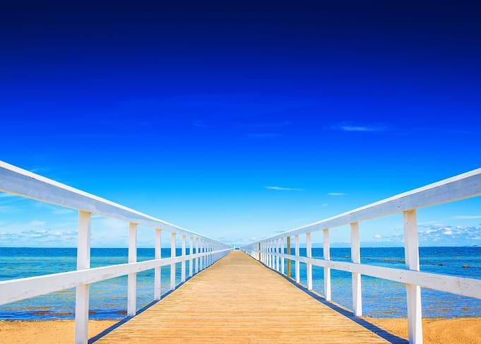 Wooden ocean dock in summer vacation resort