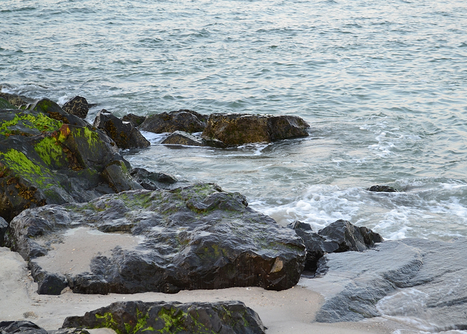 Waves hit Mossy Rocks