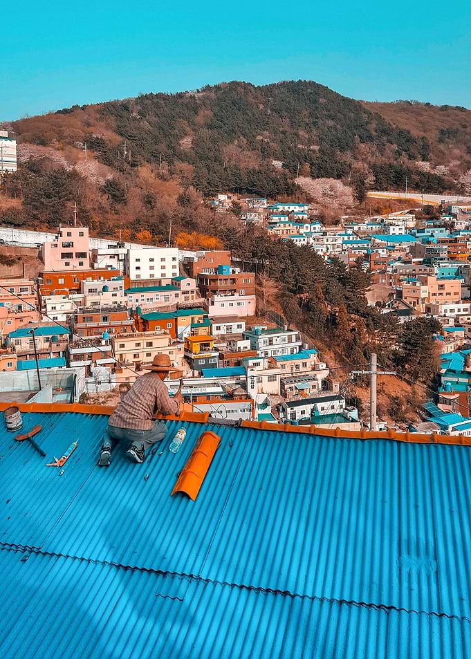 Man Repairing a Roof