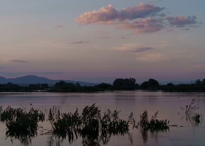 Sunset on still water