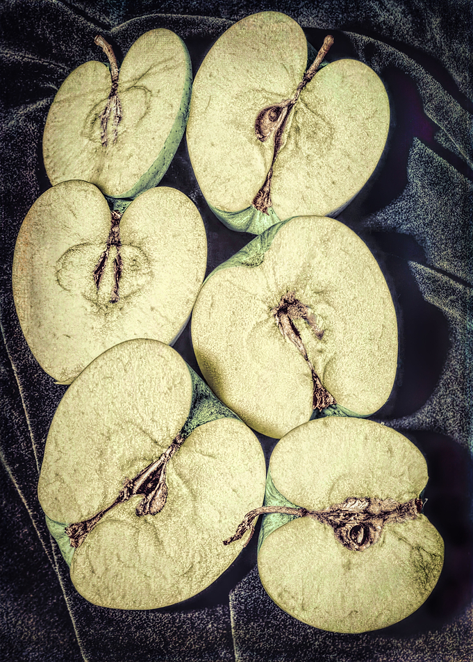 Three sliced apples
