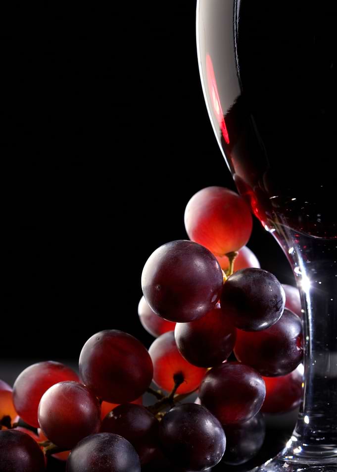Red wine with grapes