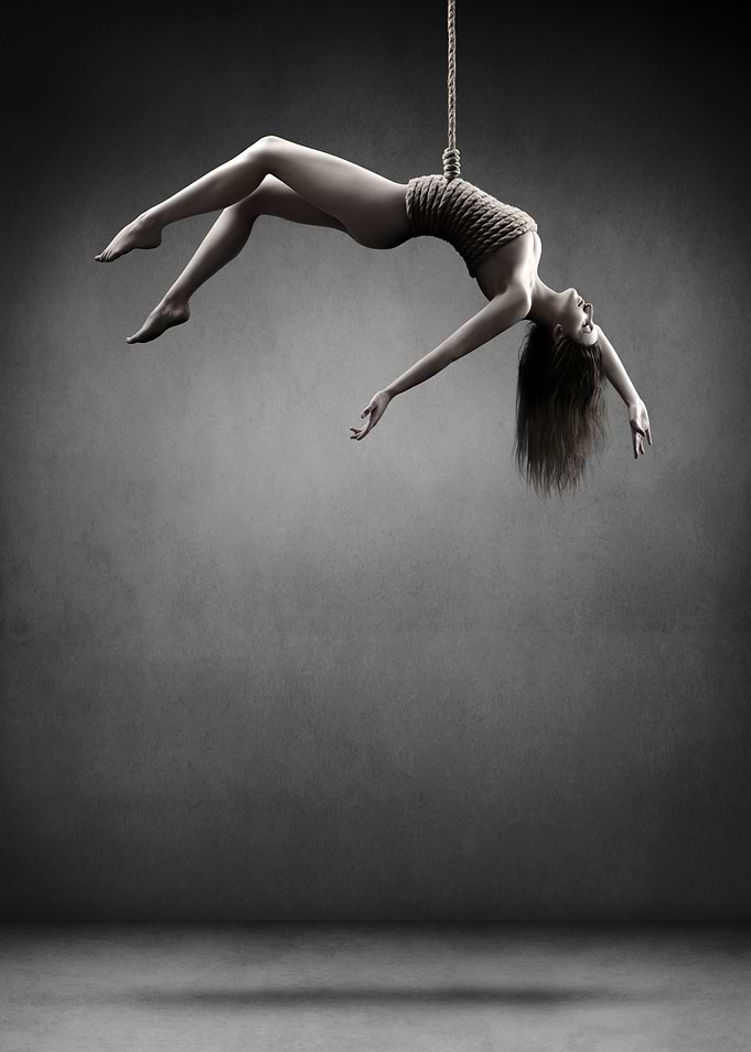 Woman hanging on a rope