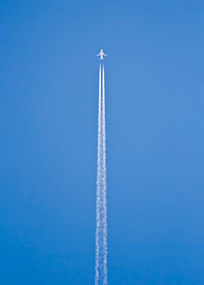 Airplane over blue