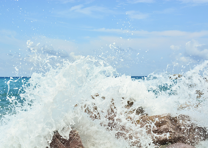 Waves splash against rocks