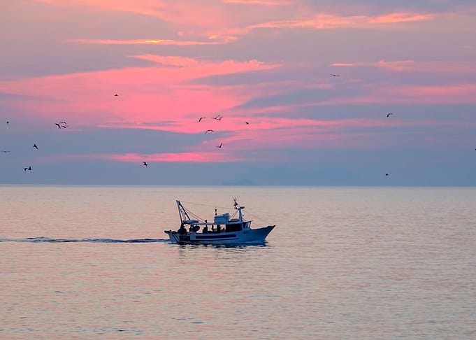 Boat at the sea with sunse