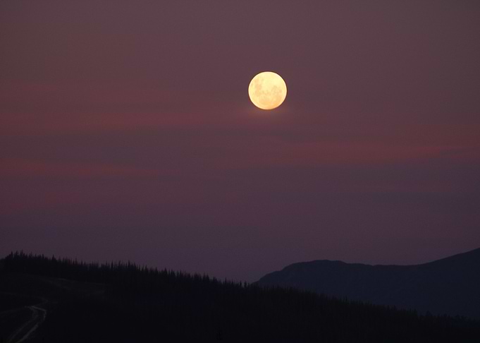 Moon over mountains