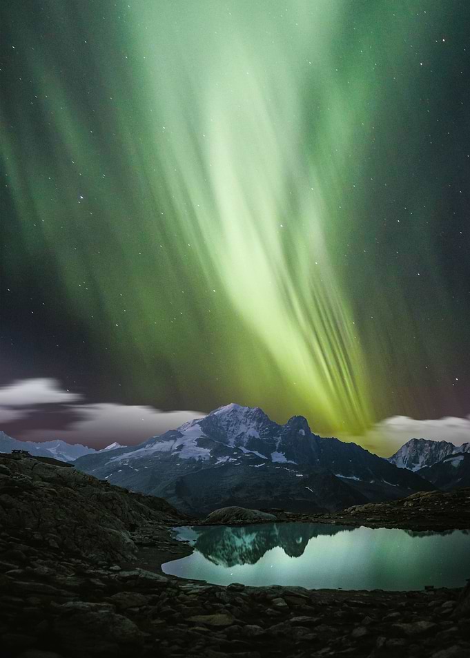 Green aurora and mountain