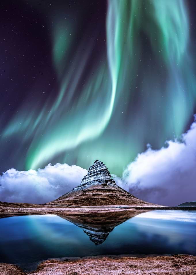 Aurora over mountain peak
