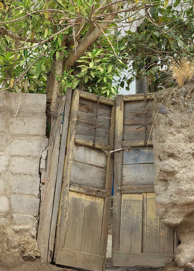 Broken Wood Door in a Wall