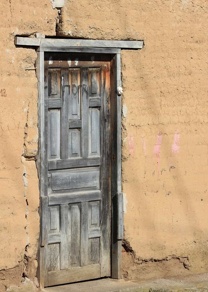 Wood Door in a Yellow Wall