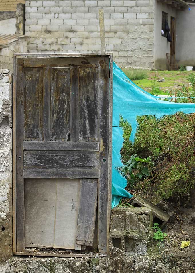 Broken Wood Door in a Wall