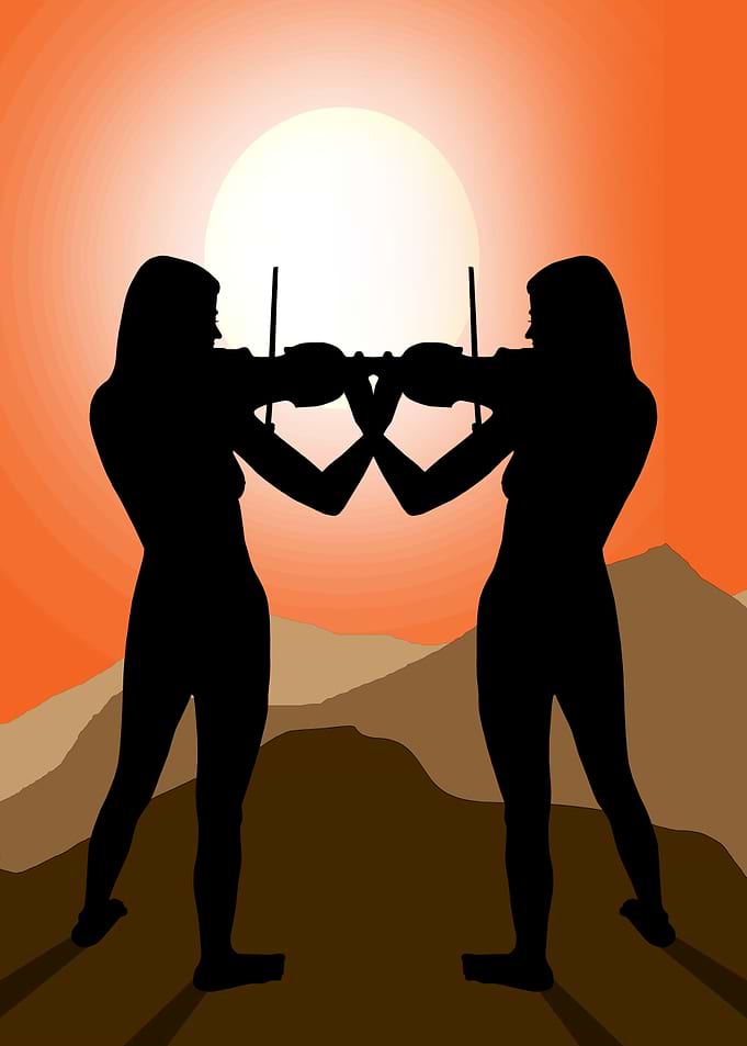 Two girls playing Violin