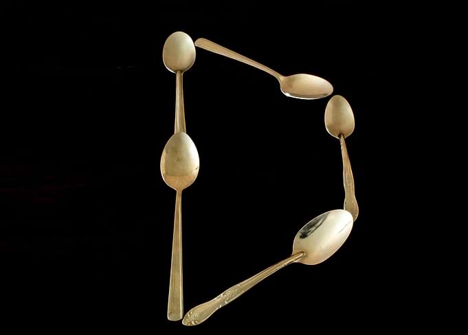 Letter D made of spoons