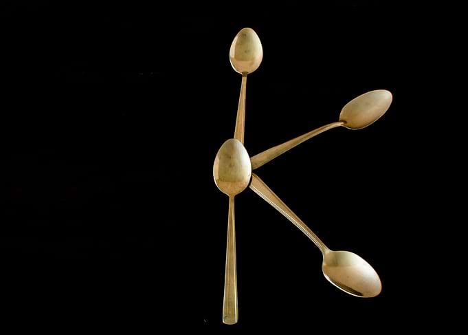 Letter K made of spoons