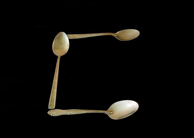 Letter C made of spoons