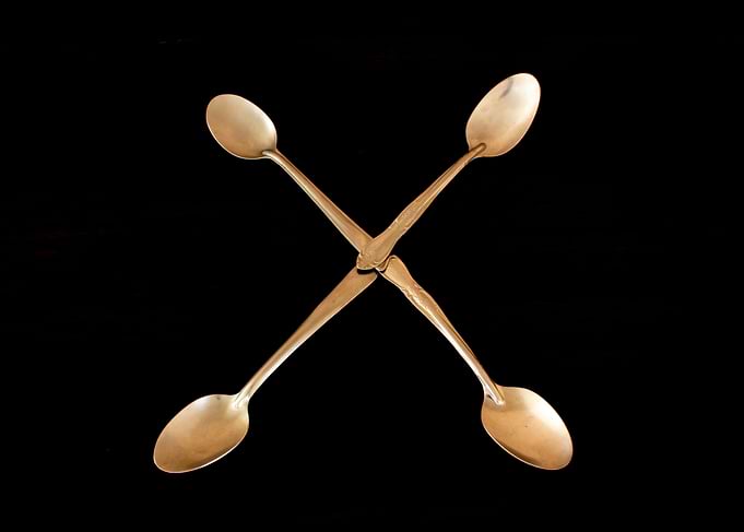 Letter X made of spoons