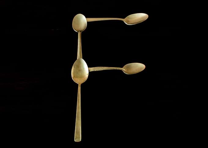 Letter F made of spoons